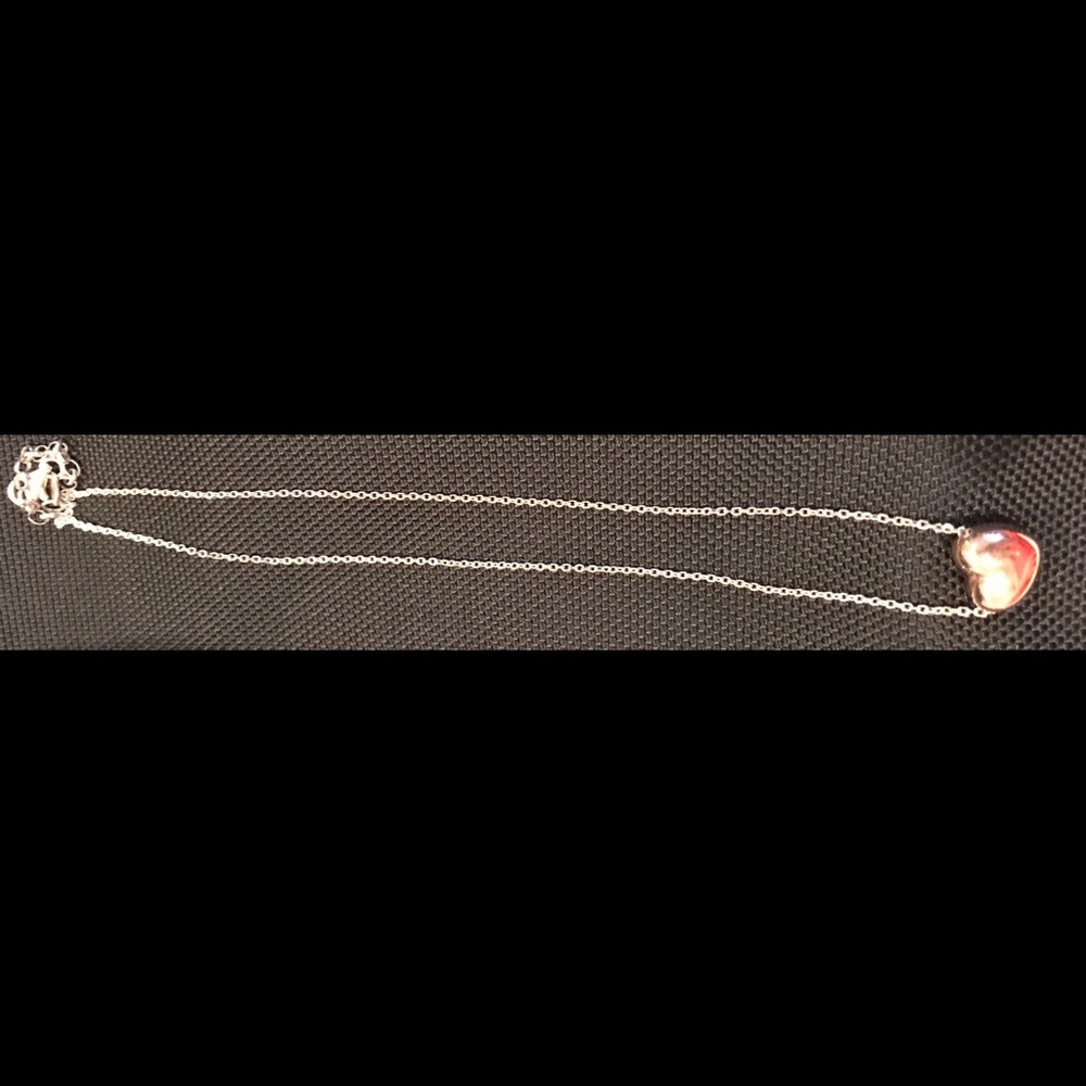 925 Silver chain with golden heart.